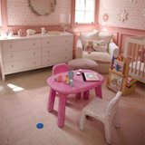 Children's room with pink furniture and decor
