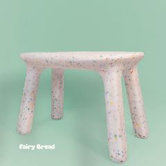 Fairy bread-themed stool on a light green background