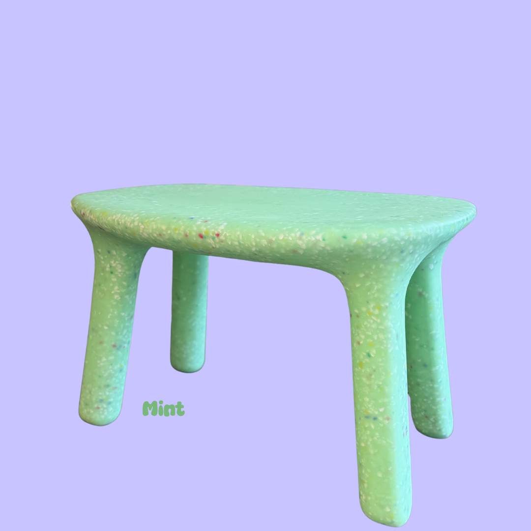 Mint green childrens table on a light purple background with 'Mint' text.