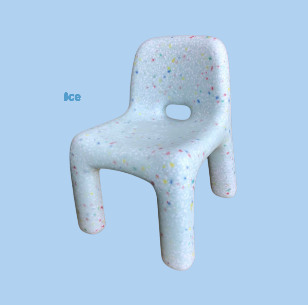 Children's chair with colorful speckles on a light blue background