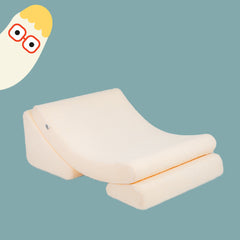 White pillow with orange stitching on a light blue background, accompanied by a cartoon parrot character.