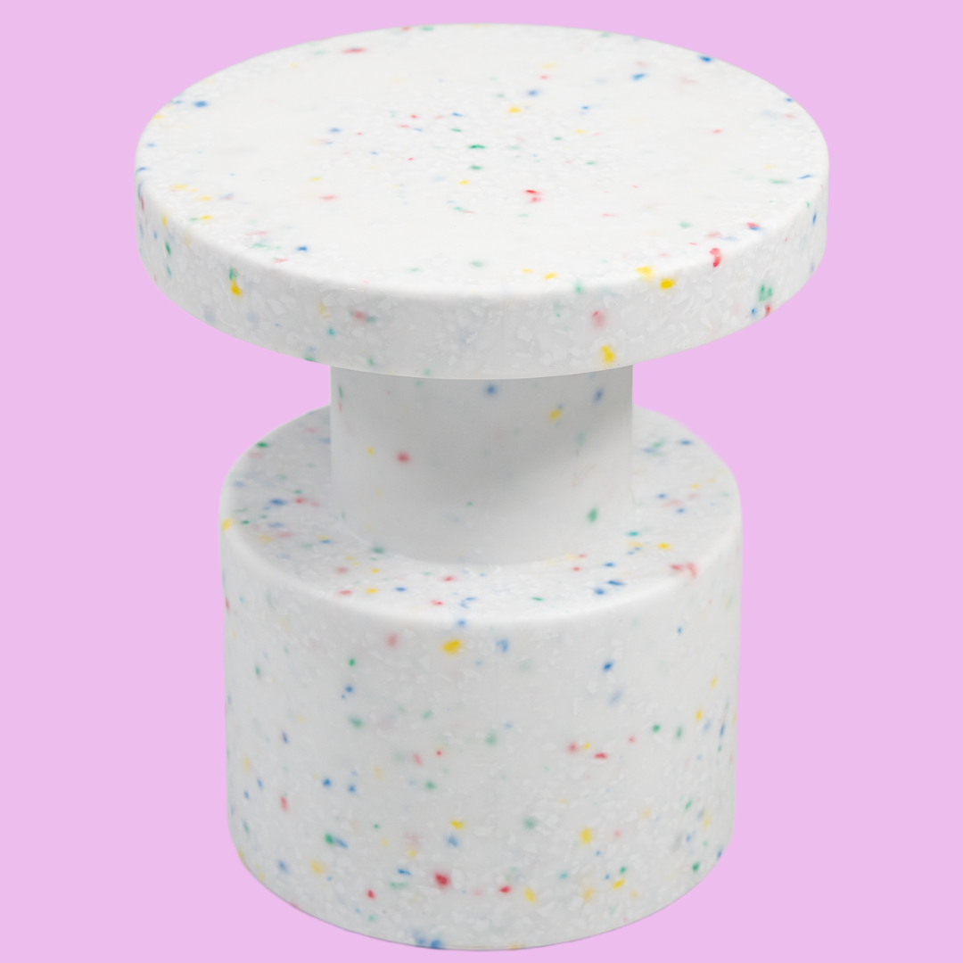 White confetti side table on pink background