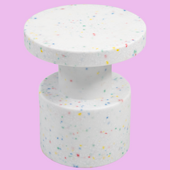 White confetti side table on pink background