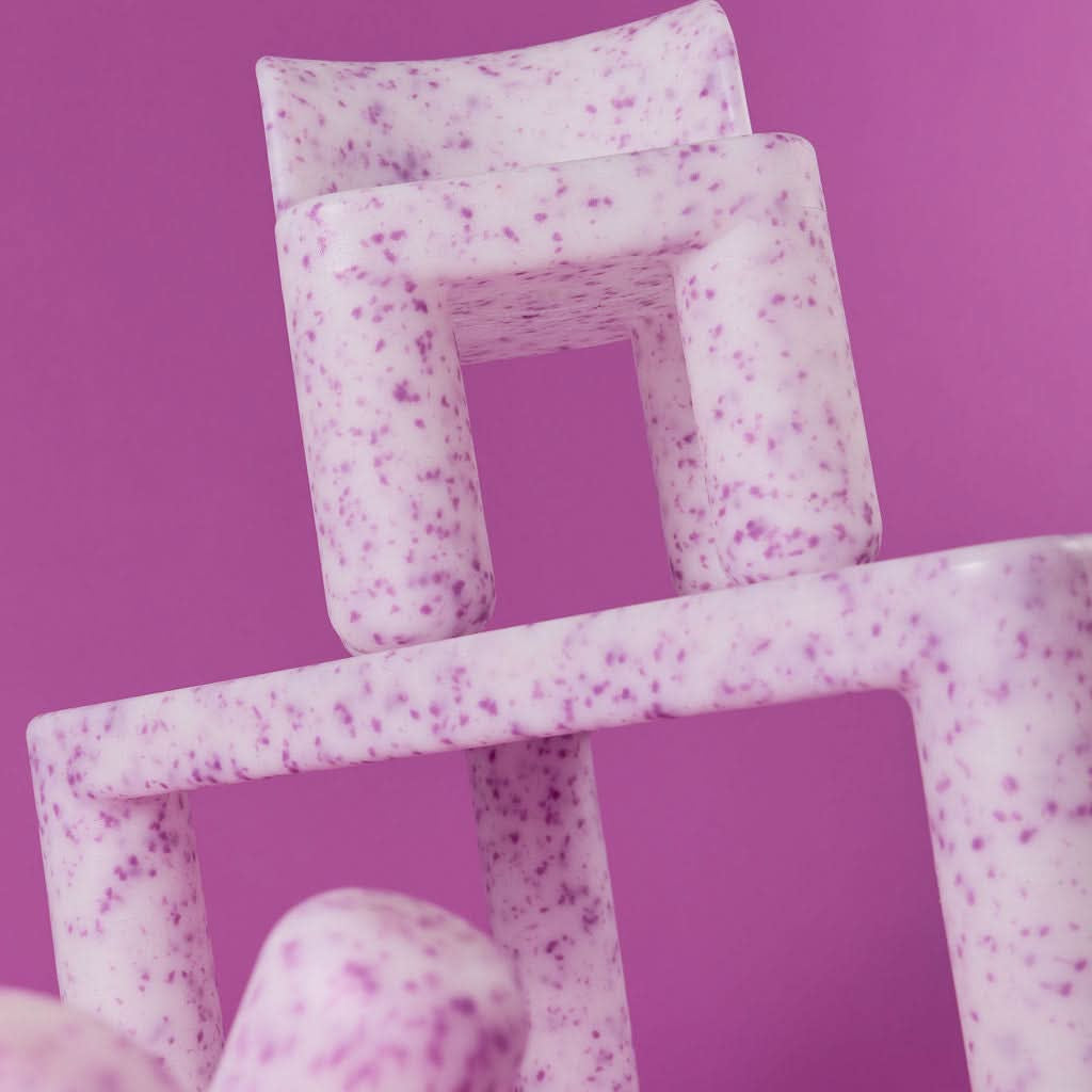Stack of pink textured boxes on a purple background