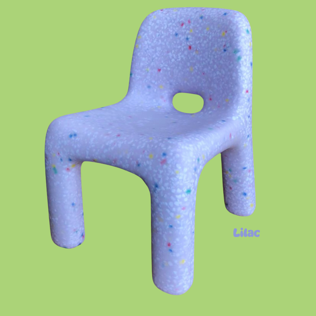 Purple chair with colorful speckles on a green background