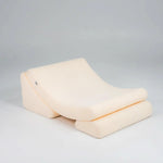 Beige wedge pillow on a gray background