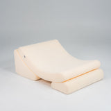 Beige wedge pillow on a gray background