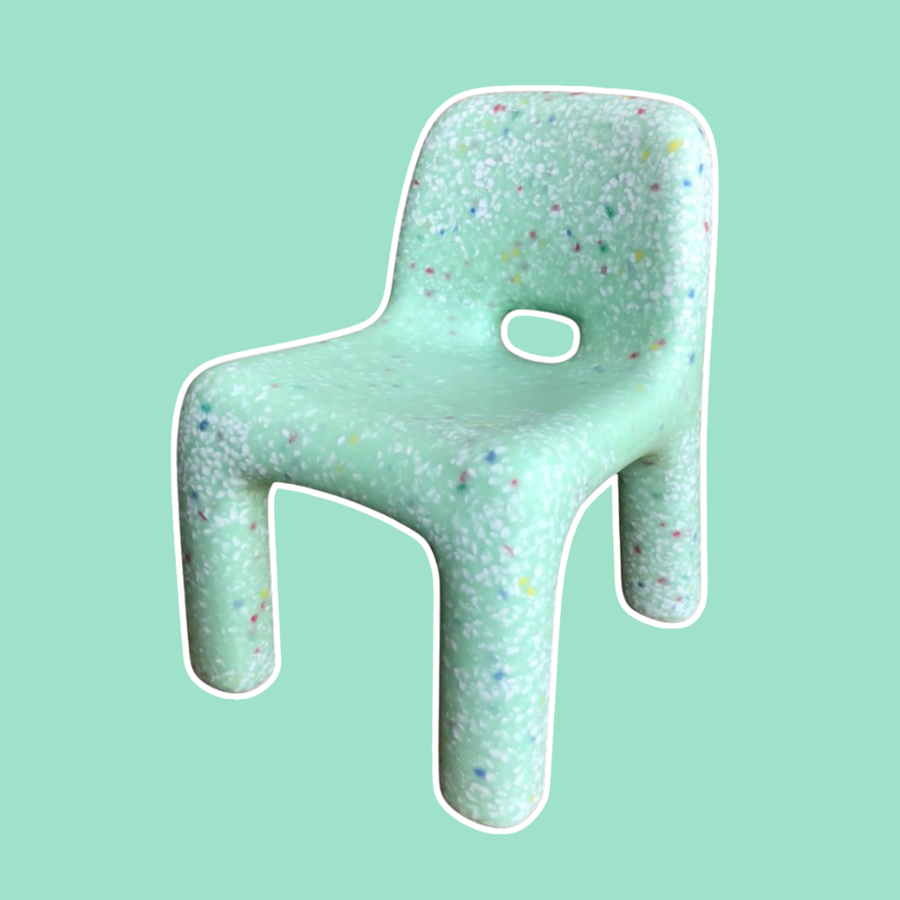 Green textured Confetti Kids chair on a light green background