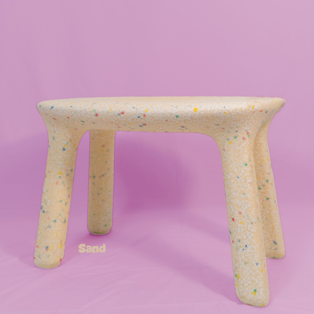 Stool with colorful speckles on a pink background