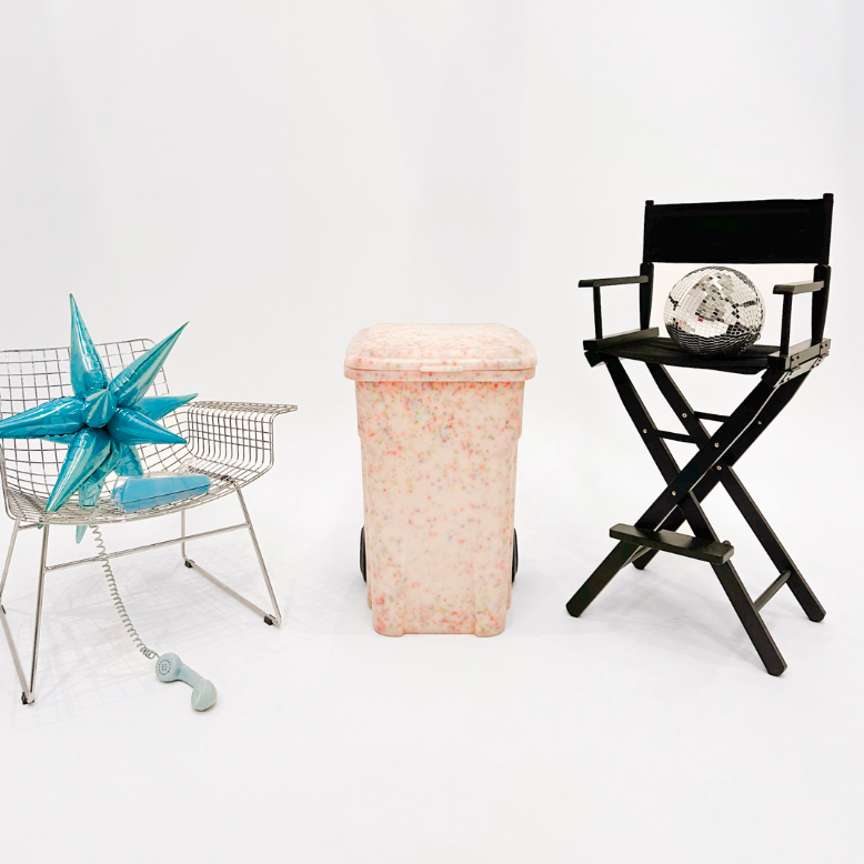 Decorative items including a star-shaped object, a black director's chair with a decorative item, and a pink woven basket on a white background.
