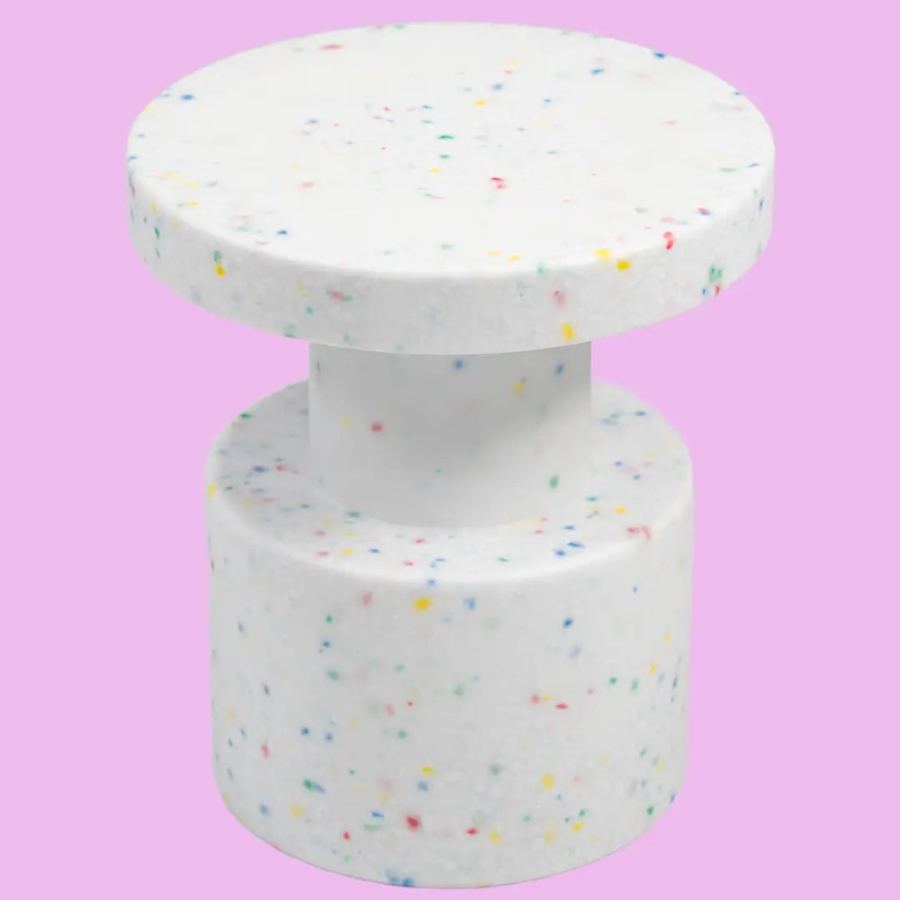White confetti side table on pink background